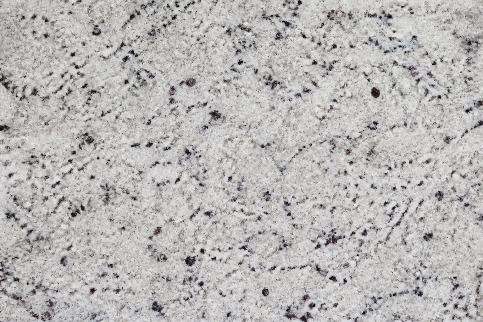 Light Kashmir White style granite with grey and burgundy speckles
