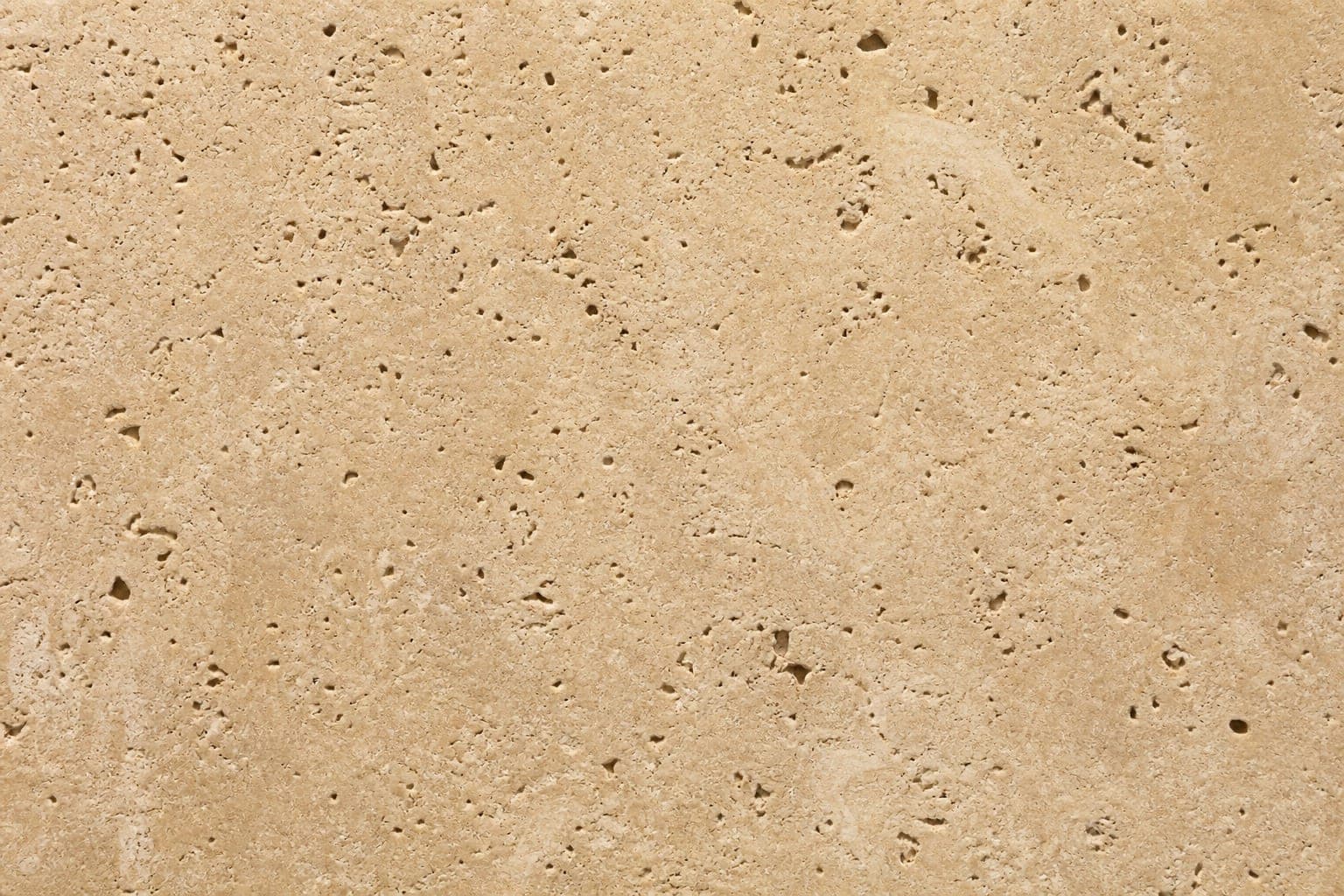 Tumbled unfilled travertine with open holes and rustic texture