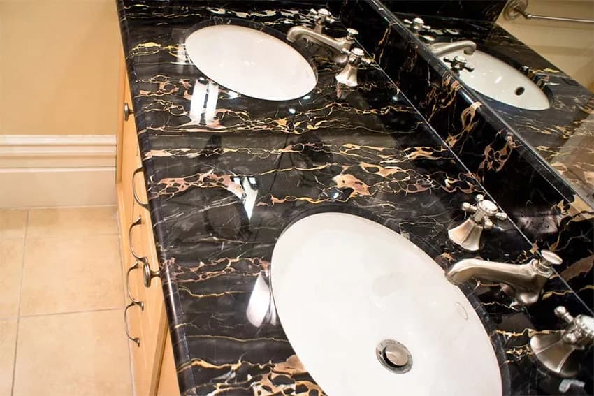 Polished black and gold marble double vanity
