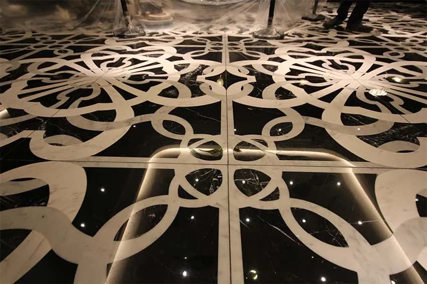 Black and white marble floor laid in a cut-stone pattern