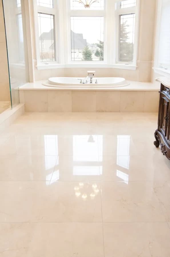 Polished cream marble bathroom floor and tub deck