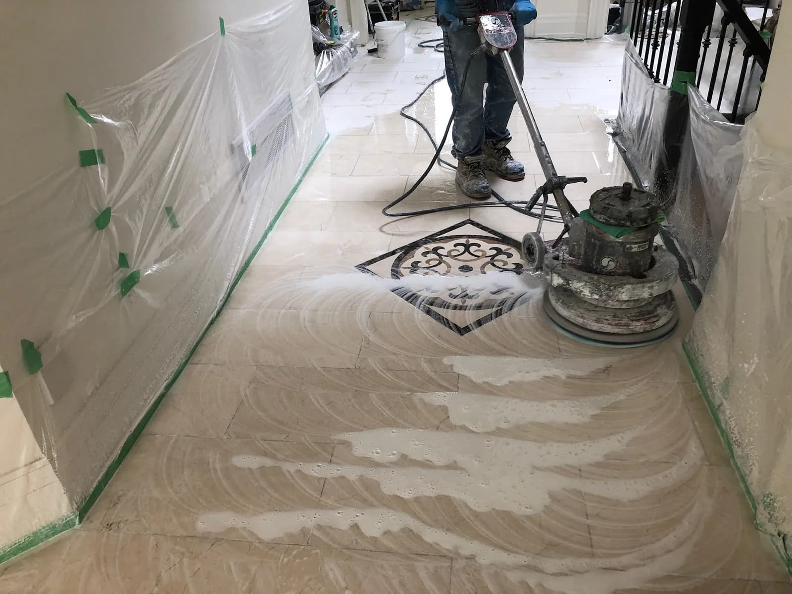 Floor machine polishing marble around an inlaid medallion