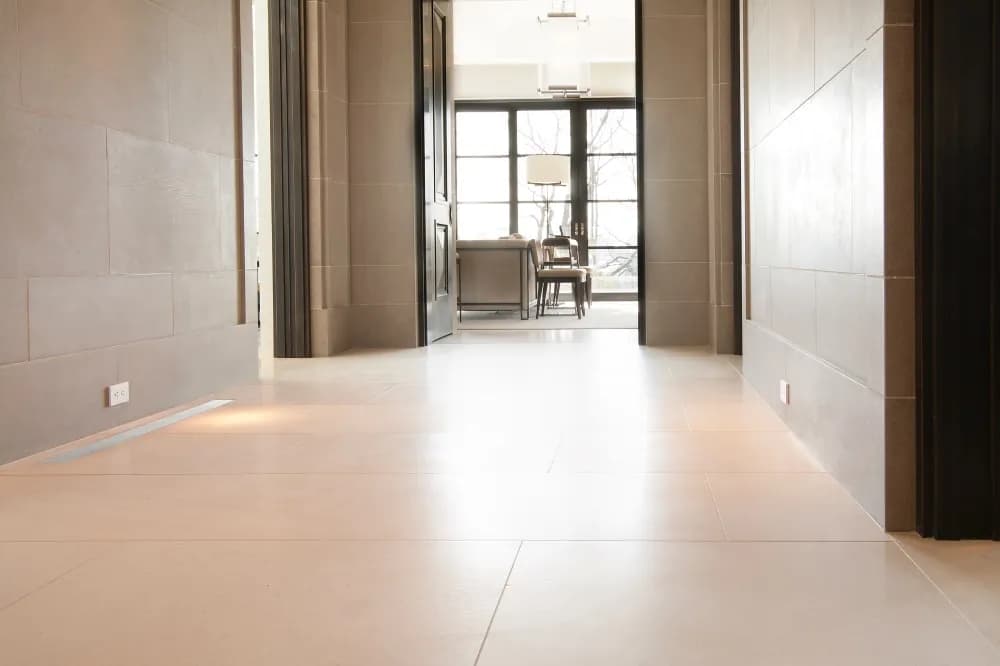 Large-format stone hallway floor after restoration