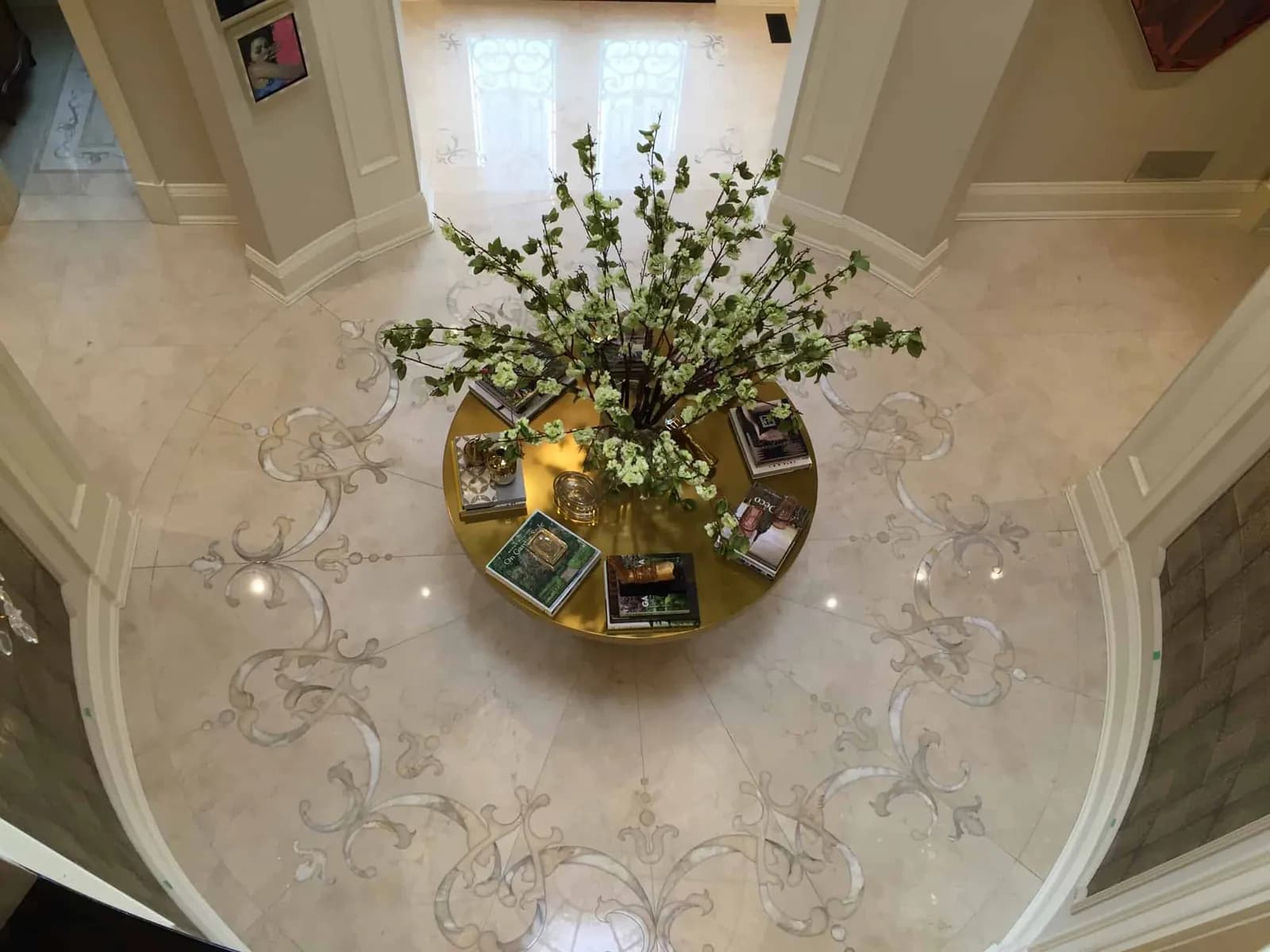 Round marble foyer with an inlaid floor medallion, seen from above