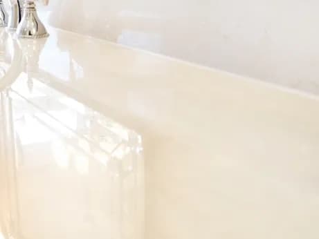Failed caulking on a marble vanity, after