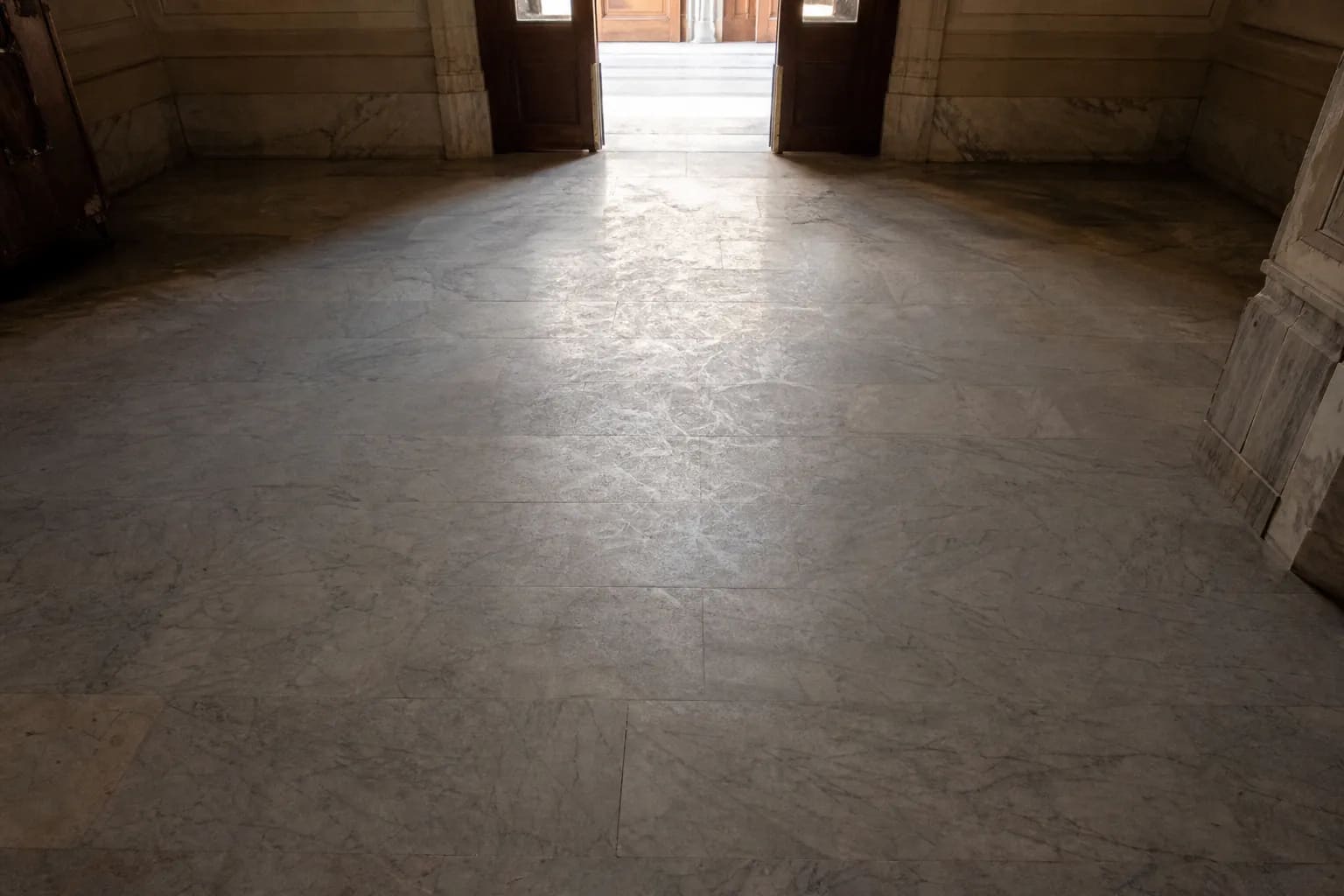 Dull, worn marble entry floor that has lost its shine
