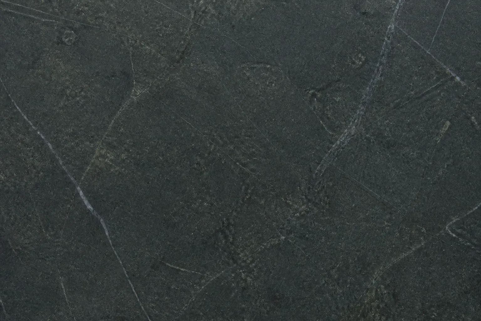 Dark soapstone countertop with soft matte charcoal tone