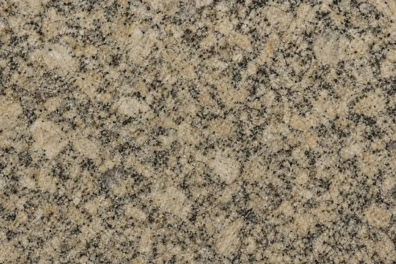Speckled granite countertop surface in warm grey and black tones
