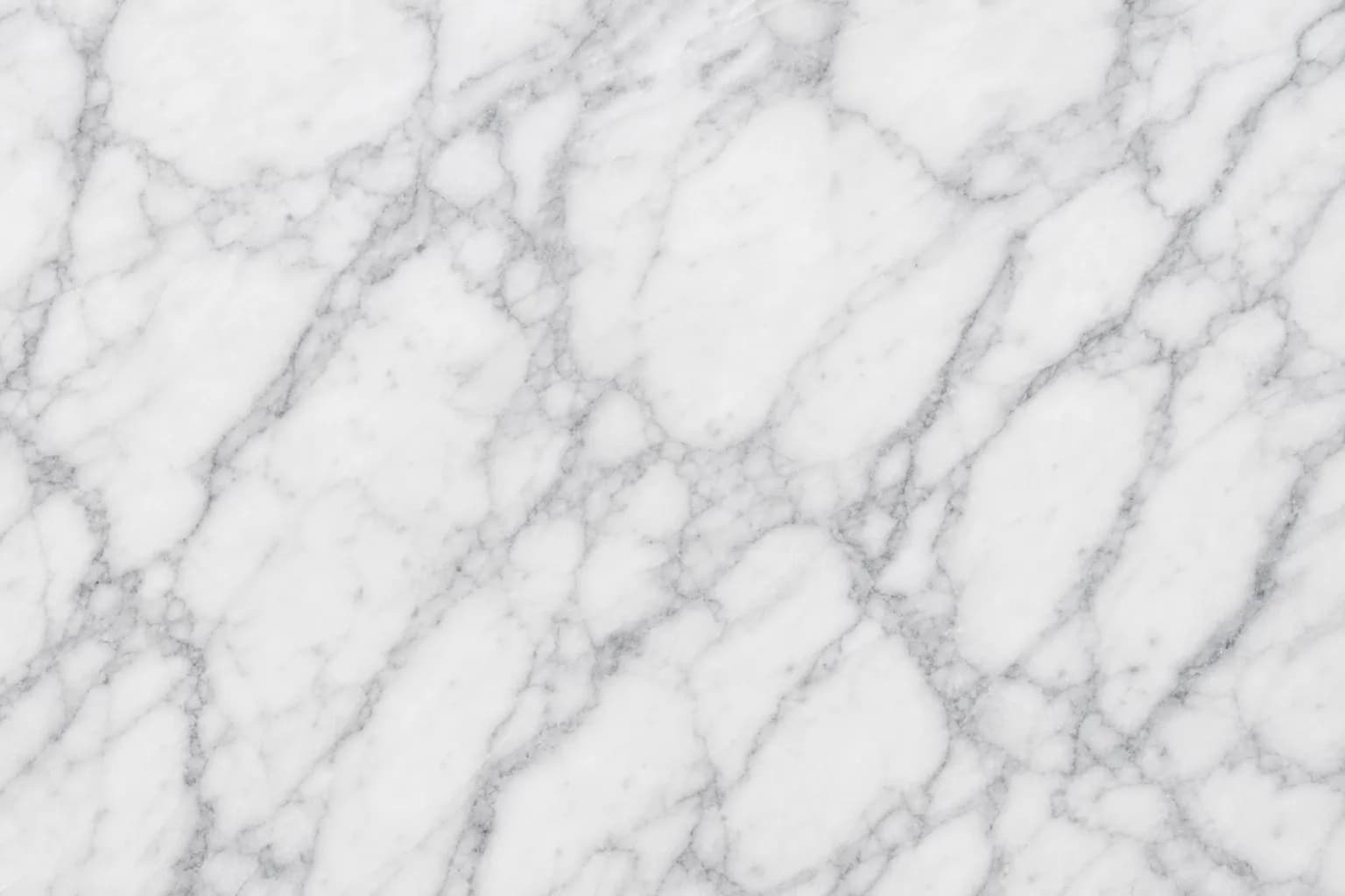 Polished white marble surface with soft grey veining