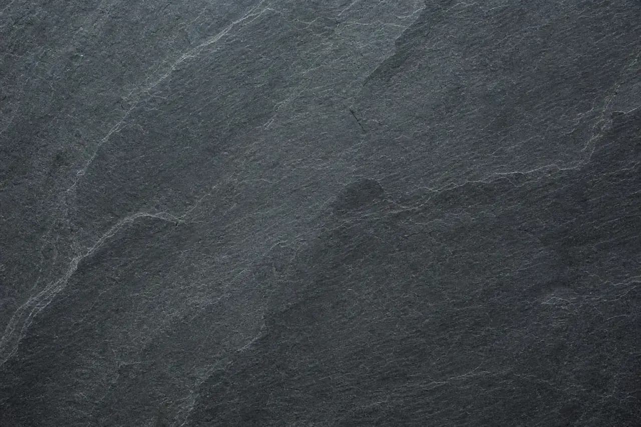 Dark honed slate floor tile with layered cleft texture