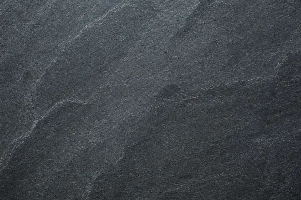 Dark honed slate floor tile with layered cleft texture